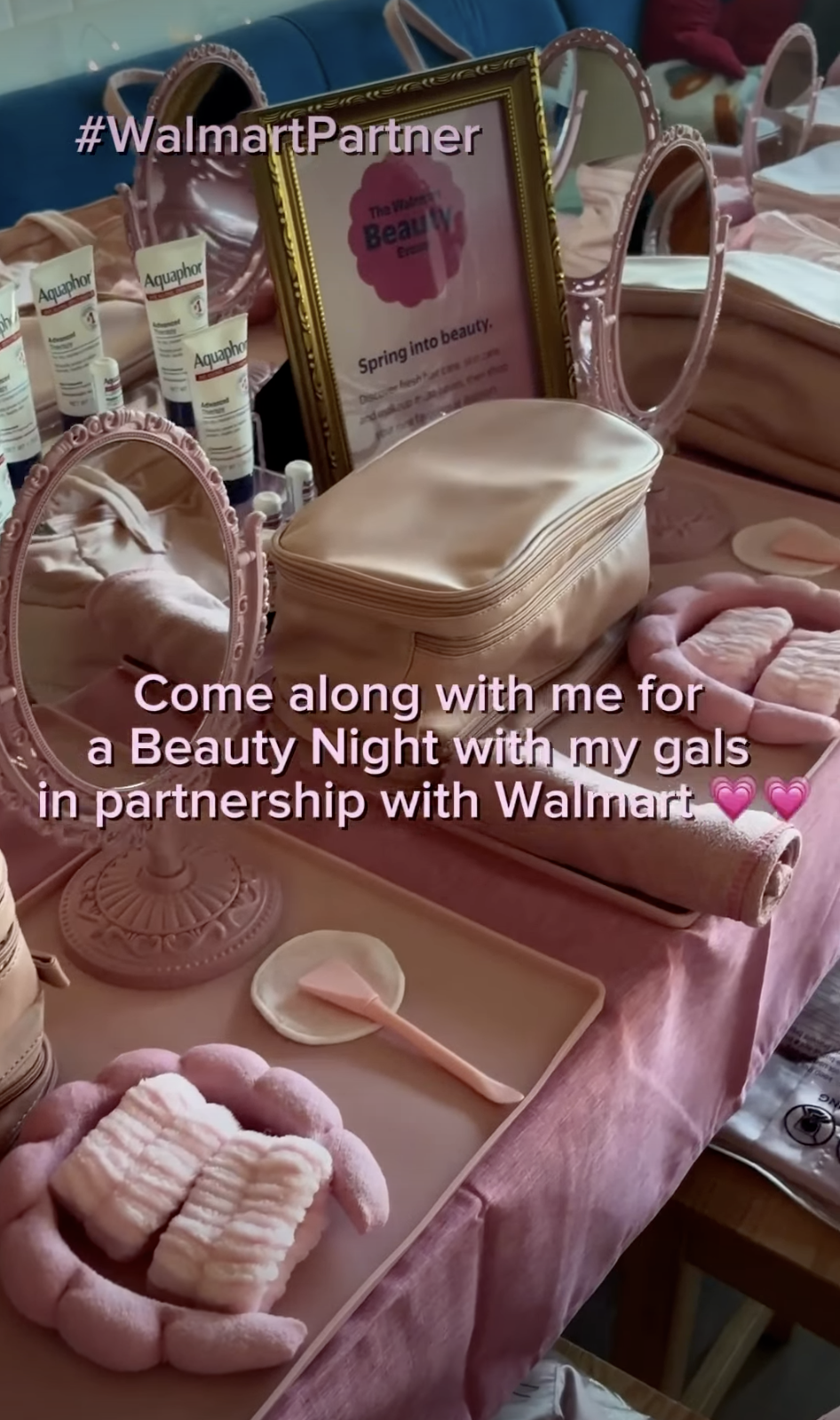 Walmart Beauty table setup with products and branded items