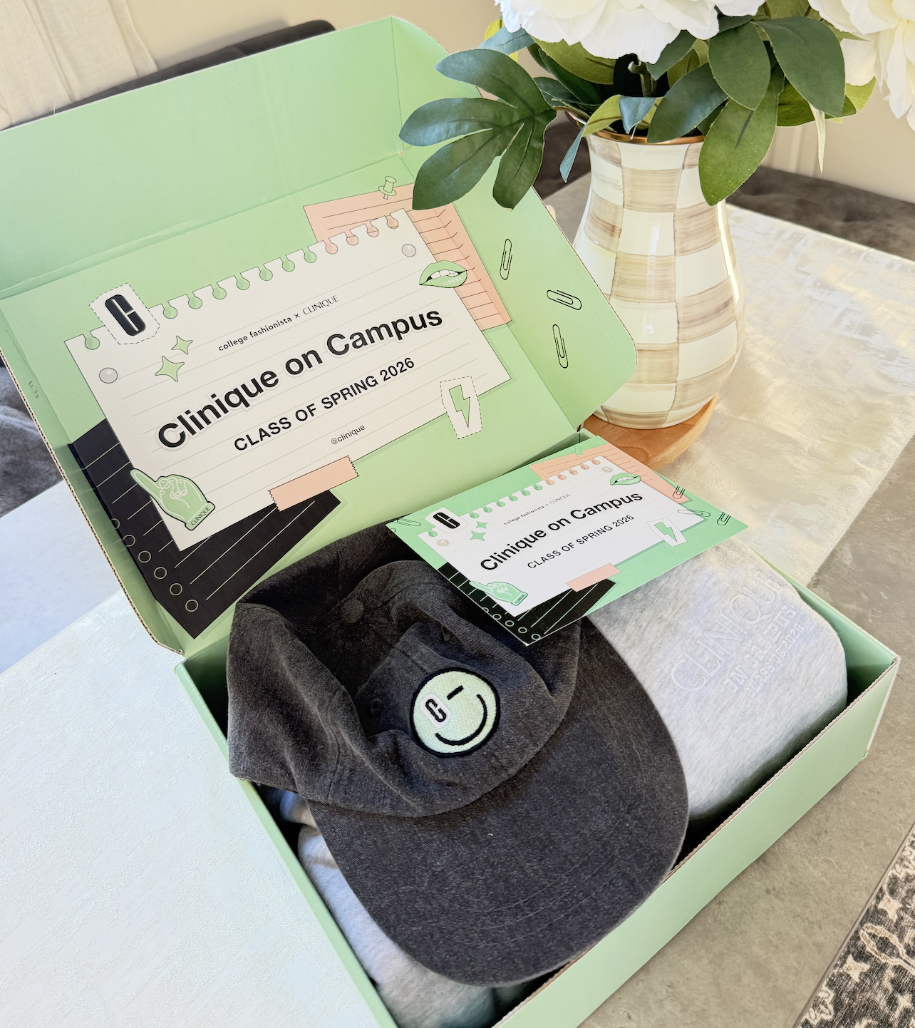 Clinique on Campus ambassador kit with green box and hat