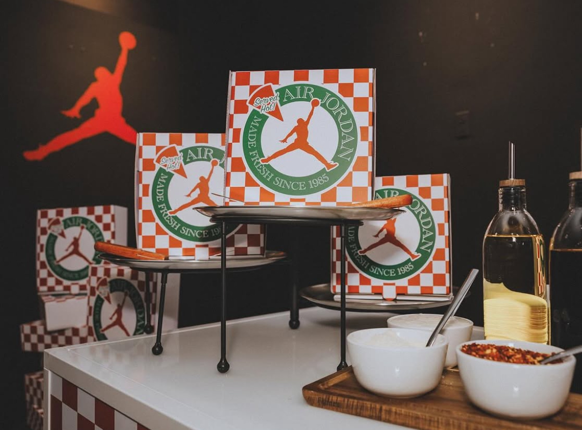 Air Jordan pizza-themed shoe boxes on pizza stands